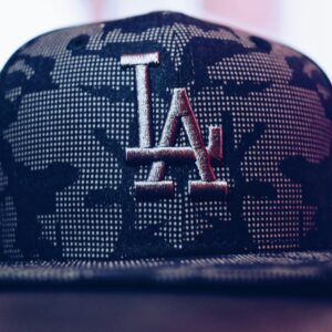 Close-up of a trendy Los Angeles baseball cap with a modern design indoors.
